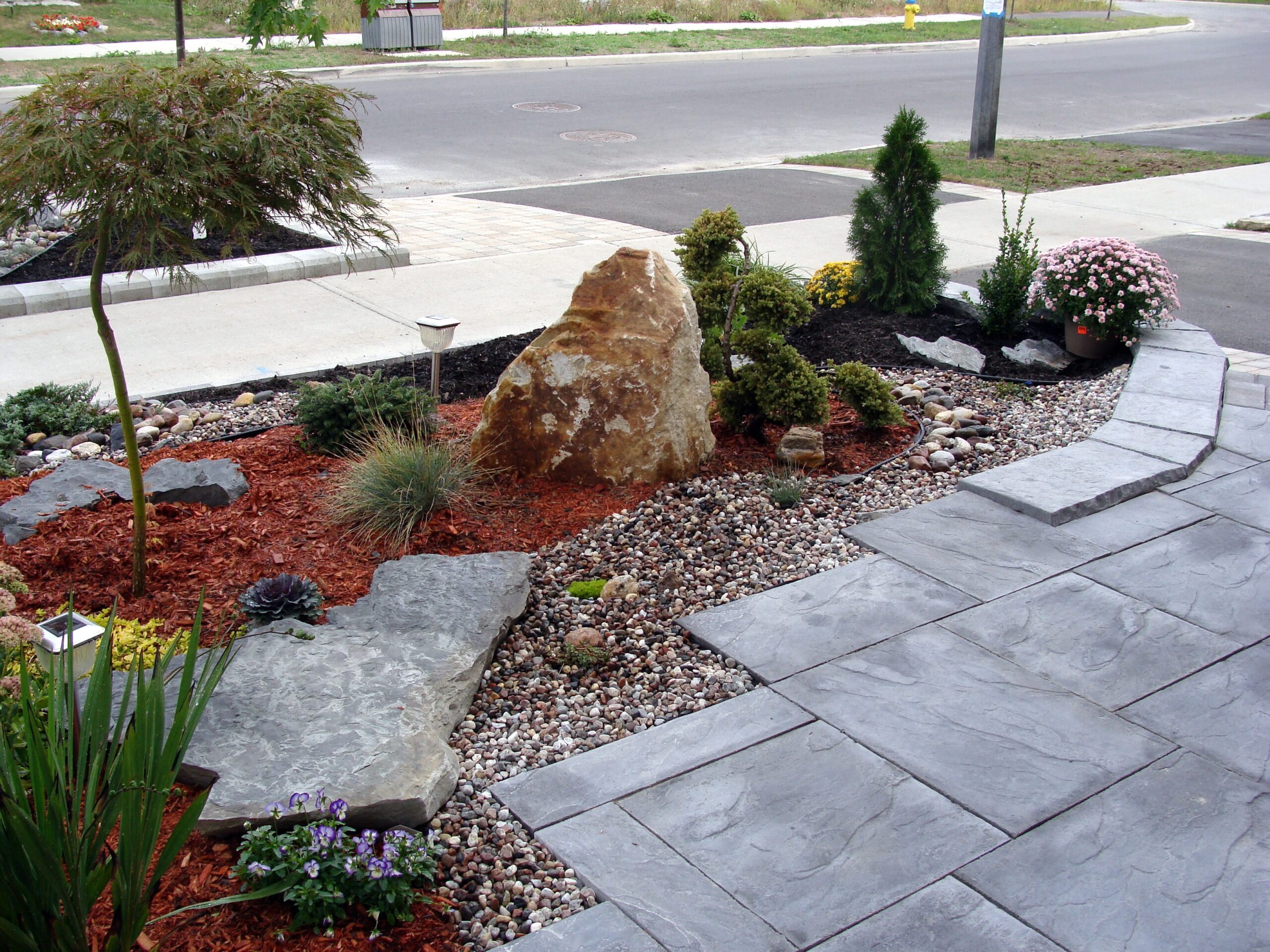 Residential mulch landscaping in front of house.